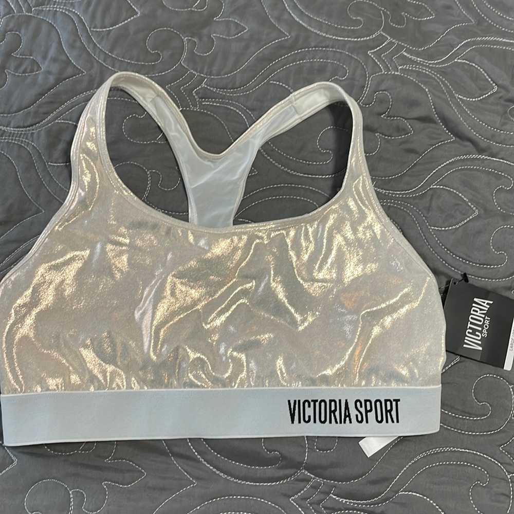NWT Victoria sport L sports bra. Shiny/iridescent color with mesh back.